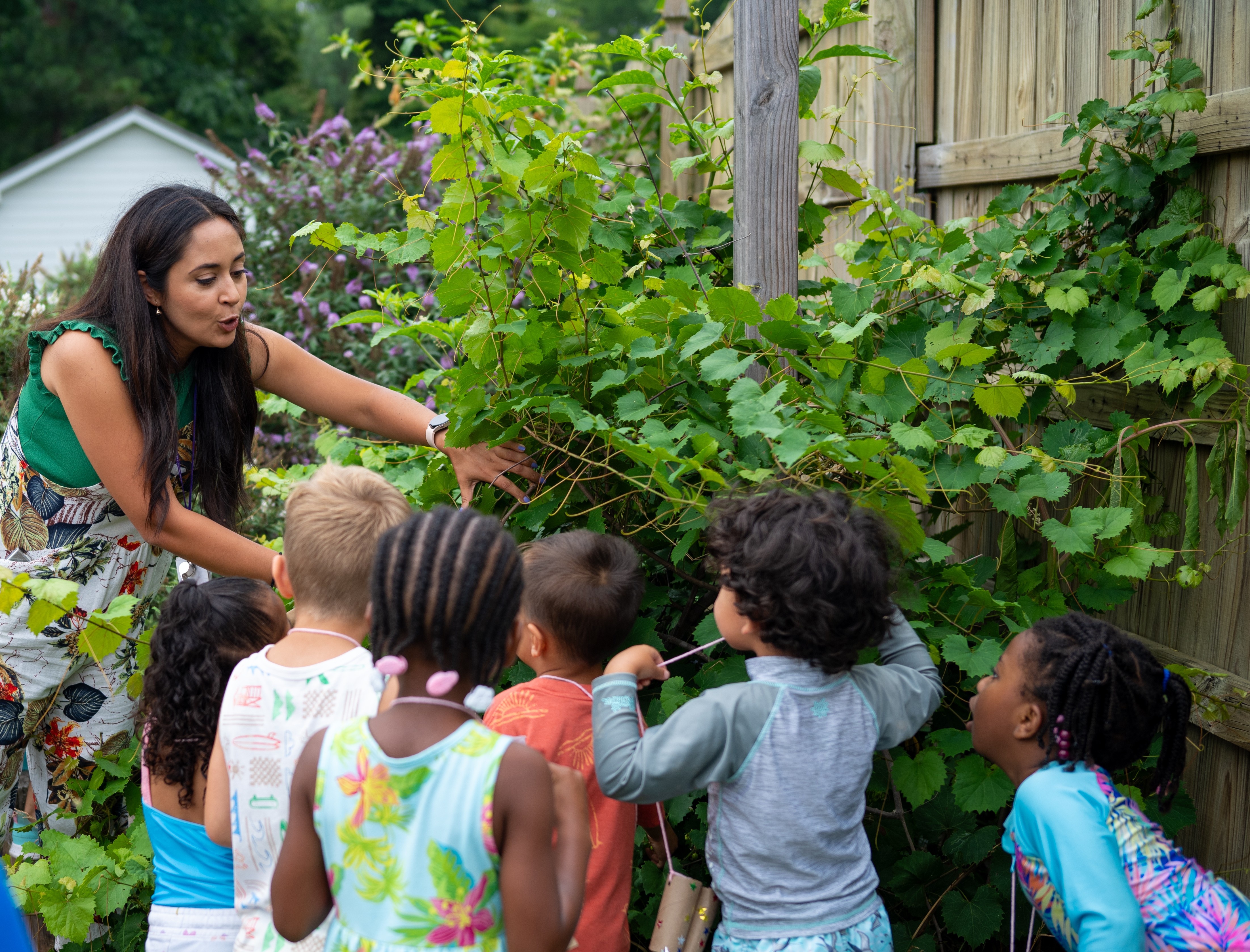 children gathering around the garden